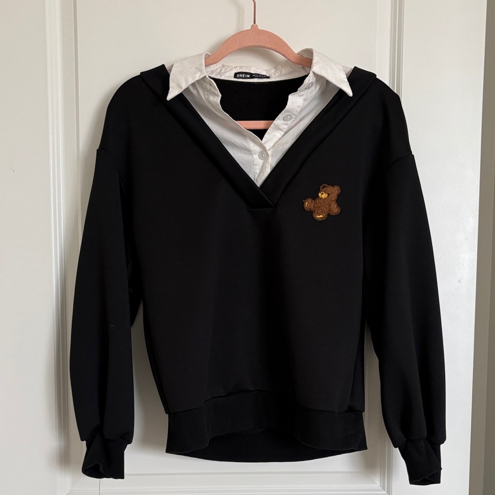 black sweater with bear patch and built in "layered" white collared shirt look